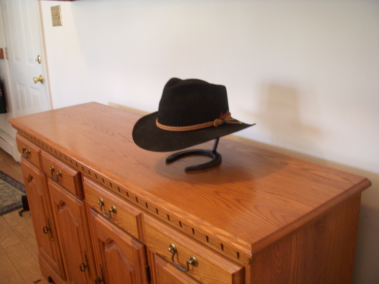 Horseshoe Cowboy Hat Stand. Hand formed 3/8 sq. stock 6 1/2L x 4 5/8W x 8H.