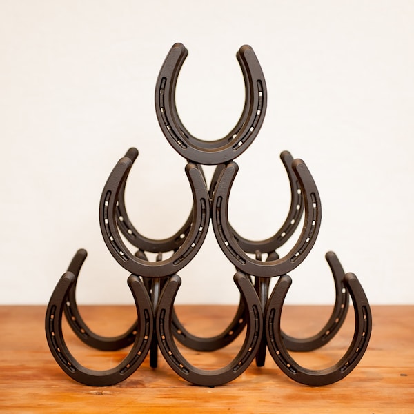 Little Filly horseshoe wine rack.  Holds six 750ml bottles of wine.  14L x 5 1/4W x 14 1/2H