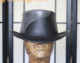 May include: A black leather cowboy hat with a gray leather band. The hat has a wide brim and a tall crown.
