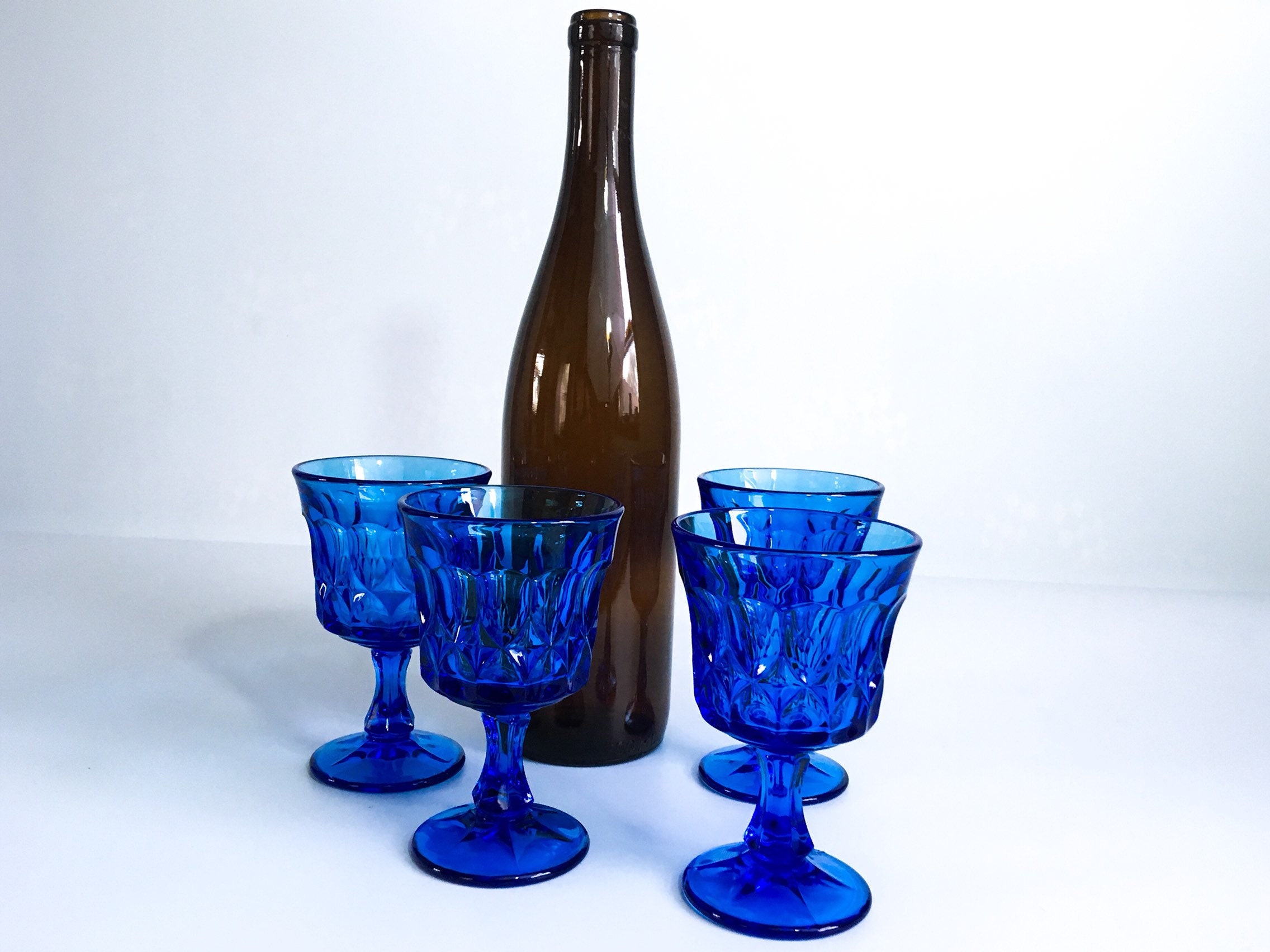 Set of 4 blue tinted wine glasses #BlueGlass #VintageWineGlasses