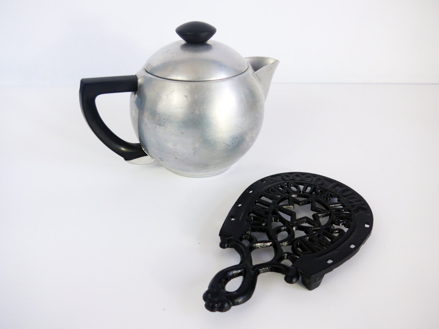 Vintage Black Cast Iron Trivet Good Luck Stamped JZH 1950