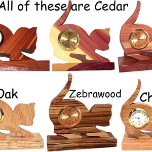 May include: Six wooden cat clock figurines, each made from a different type of wood. The woods are Cedar, Oak, Zebrawood, and Cherry.  All of these are Cedar.
