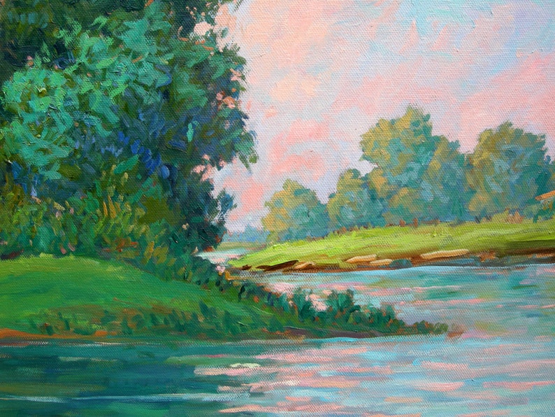May include: A painting of a river scene with a lush green bank on the left side of the image. The river is a light blue color and the bank is covered in green grass and trees. The sky is a light pink color with a few clouds.