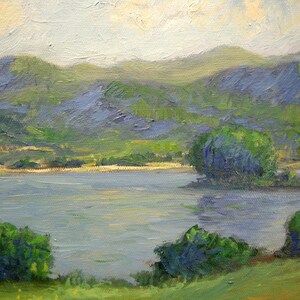May include: Landscape painting depicting a tranquil lake scene.  The foreground shows lush green vegetation, while the mid-ground features a calm body of water reflecting the sky.  The background showcases rolling hills in varying shades of green and blue, painted with visible brushstrokes. The overall palette is soft and muted, with blues, greens, and light grays dominating the composition. The style suggests Impressionism or Post-Impressionism, with a focus on capturing light and atmosphere.