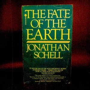 May include: A green book cover with the title "The Fate of the Earth" in yellow letters. The author's name, Jonathan Schell, is also in yellow letters. The book cover includes quotes from Walter Cronkite and Jerome B. Wiesner.