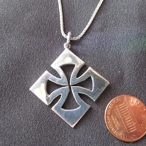 Heavy weight, Handmade, Sterling Silver variation of the Maltese Cross, 1 inch across.