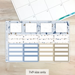 May include: A set of 7x9 inch planner stickers with a blue and white floral design. The stickers include boxes for writing, a patterned strip, and a blank space for writing.