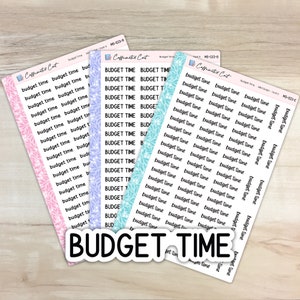 May include: A selection of planner stickers featuring the text "budget time" in different fonts and colours. The stickers are set against white backgrounds with decorative borders in pink, blue, and teal. A larger sticker with the words "budget time" is also visible.