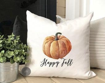 May include: White pillow with a watercolor illustration of a pumpkin and the text "Happy Fall".