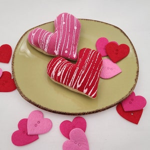 Two Frosted Heart Cookie catnip toys.