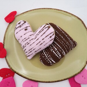 Two Frosted Heart Cookie catnip toys.