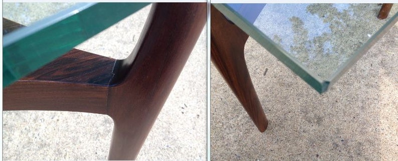 K&ouml;nnte beinhalten: Nahaufnahme eines Tisches aus dunklem Holz mit einer Glasplatte. Der Tisch hat ein einzigartiges Design mit abgewinkelten Beinen.