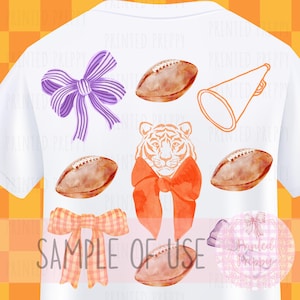 May include: A white t-shirt featuring a design of a tiger wearing a bow tie, footballs, a megaphone, and bows in purple, orange, and pink. The text "Sample of Use" is printed on the shirt.