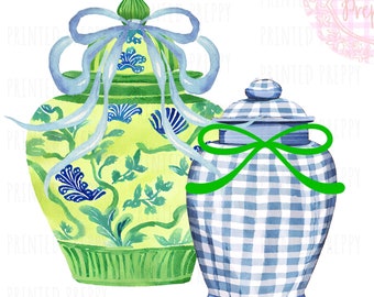 May include: Two decorative ceramic jars with lids. The larger jar is green with blue and white floral designs and a light blue ribbon. The smaller jar is blue and white gingham with a green ribbon.