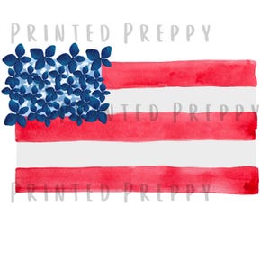May include: Watercolor illustration of the American flag with red and white stripes. The stars are replaced with blue flower blossoms. The words "PRINTED PREPPY" are printed in light gray across the top and bottom of the image.