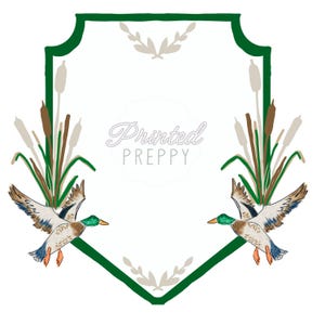 May include: Watercolor illustration featuring two ducks in flight, cattails, and the text "Printed Preppy" within a green-bordered frame. The ducks have green heads, brown bodies, and blue wings.