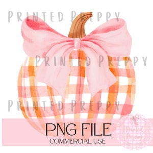 May include: A watercolor illustration of a pumpkin with a pink and orange plaid pattern and a large pink bow. The pumpkin is isolated on a white background. PNG FILE COMMERCIAL USE.