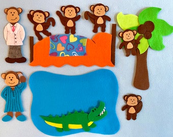 May include: Felt toy set featuring a brown alligator, a blue pond, a brown palm tree with coconuts, and six brown monkeys. One monkey is wearing a blue and white striped shirt, another is wearing a white doctor's coat, and the rest are wearing nothing. The monkeys are on a bed with a red and orange headboard and a blue and green blanket with pink hearts.