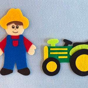 May include: A felt toy set featuring a farmer wearing a yellow hat and blue overalls, and a green tractor with yellow wheels.