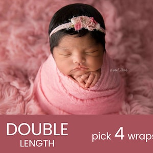 May include: A pink newborn baby swaddled in a pink knitted wrap, wearing a pink flower headband. The baby is sleeping with its hands tucked in. The background is a pink fluffy surface.  The text "Sweet Peas" is visible in the image.  The text "DOUBLE LENGTH pick 4 wraps" is visible in the image.