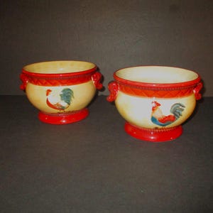 May include: A set of three ceramic mugs with a speckled, matte finish. The mugs are in shades of cream, light gray, and dark gray. Each mug has a simple, minimalist design, perfect for coffee or tea.