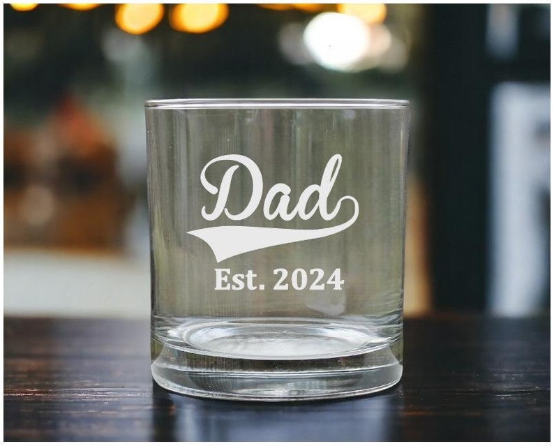 This engraved "Dad" whiskey glass is the perfect personalized gift for him. Custom etched with "Dad," it’s a unique and thoughtful gift for Father’s Day, birthdays, or any special occasion. It's perfect for whiskey, scotch, or his favorite drink.