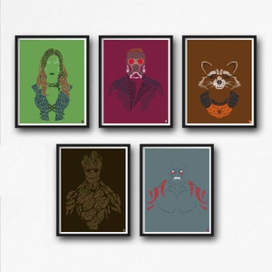 May include: Five framed posters featuring characters from the Guardians of the Galaxy movie. Each poster features a different character, including Gamora, Star-Lord, Rocket Raccoon, Groot, and Drax. The posters are all in a minimalist style, with the characters' silhouettes created from words related to the movie.
