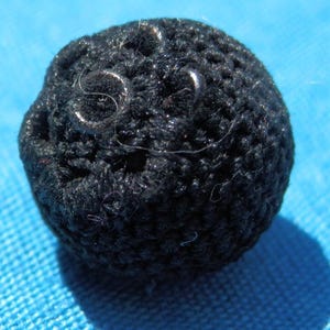 Antiek draad bloemenknoop