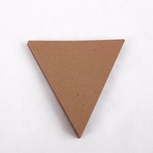 May include: A brown triangle-shaped piece of cardboard.