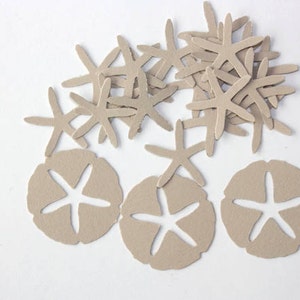 May include: A collection of tan felt starfish and sand dollar shapes. The starfish have five arms, and the sand dollars have a five-pointed star cut out of the center. These craft supplies are ideal for beach-themed projects.
