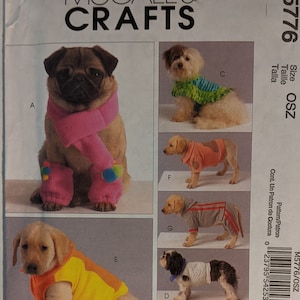 May include: A sewing pattern for making dog clothes. The pattern includes instructions for making a variety of dog clothes, including a scarf, a sweater, a vest, and a jumpsuit. The pattern is for size OSZ.