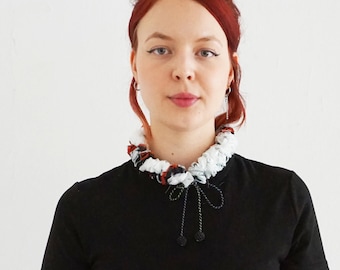 Ruff from organic cotton with handmade ribbons and embroidered beads balls