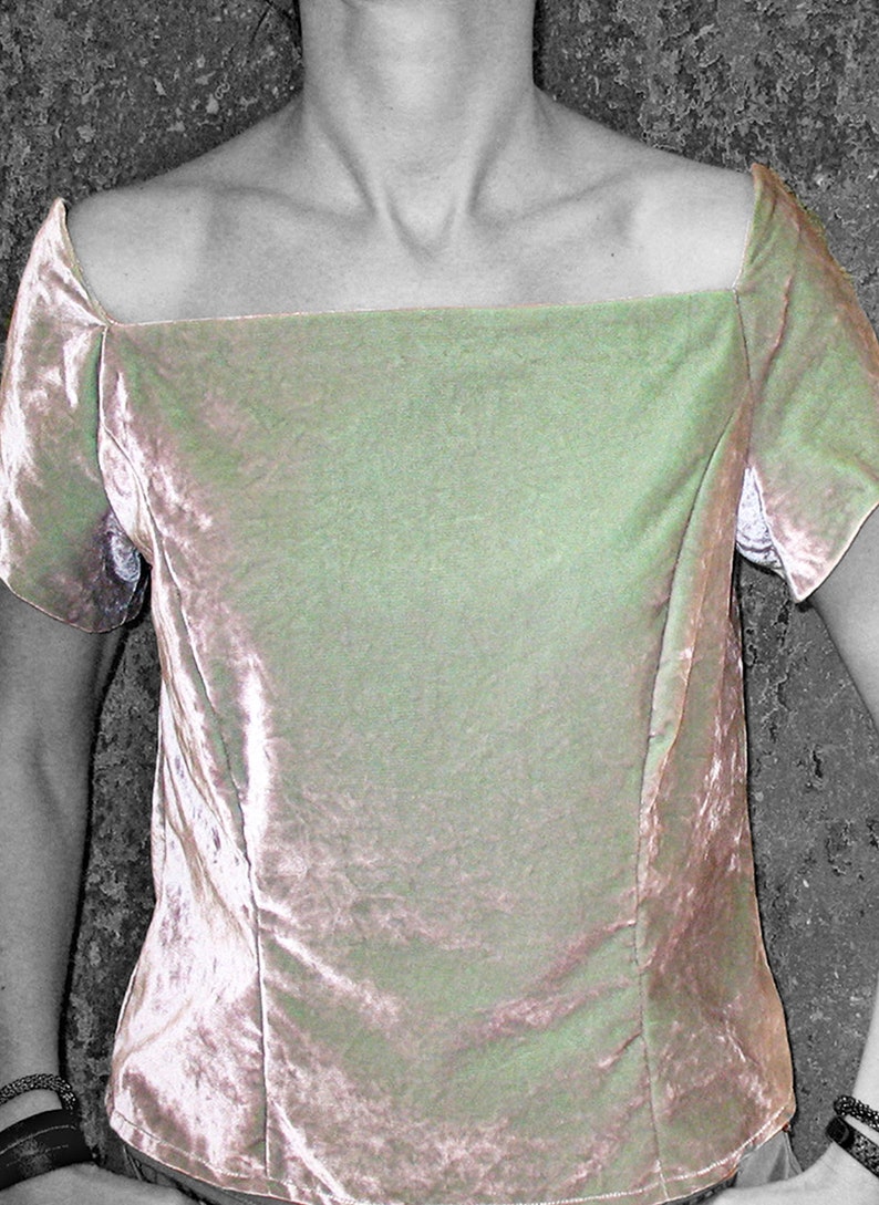 May include: A light pink velvet top with a square neckline and short sleeves.