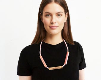 UNICAT Necklace made with vintage cardboard spools and an upcycled synthetic ribbon