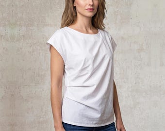 Elegant women's top with draping and cut sleeves I asymmetrical pleat details