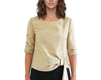 Women’s blouse with side draping and half-length sleeves - pleats details