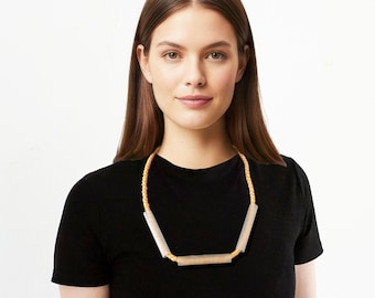 UNICAT Necklace with transparent spools of thread, beads zylinder & hand-knotted ribbon