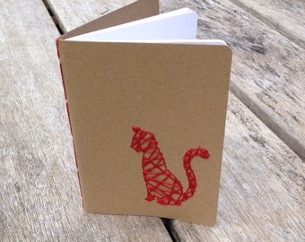 Kraft notebook with embroidered, distressed cat, pussycat in red