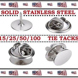 May include: Solid stainless steel tie tacks in various styles. The image shows four different tie tack designs, including a pin-style tack and several clasp-style tacks. Text on the image reads "15/25/50/100" and "Tie Tacks".