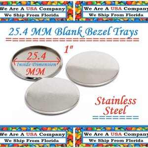 May include: Two silver blank bezel trays, 1 inch in diameter, with a 25.4 mm inside dimension. The trays are made of stainless steel. The text "25.4 MM Blank Bezel Trays" is printed in black at the top of the image. The text "1" is printed in black to the right of the trays. The text "25.4" is printed in black inside the left tray. The text "Inside Dimension MM" is printed in black below the number 25.4. The text "Stainless Steel" is printed in black at the bottom of the image.