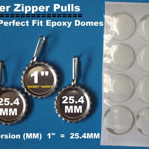 May include: Silver zipper pulls with clear epoxy domes. The pulls are 1 inch in diameter and have a 25.4 mm measurement printed on them. The domes are packaged on a sheet of 9.