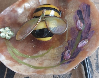 Beautiful crafted periwinkle bees and hand painted pistachio shell lady birds on shell pendants by Cornish Artist Lindsey Keates