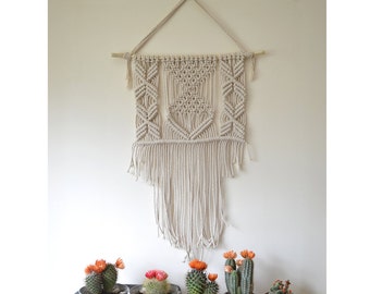 Macrame wall hanging with natural cotton rope on a reclaimed tree branch. 70s, minimal, boho, modern, vintage, geometrical,boho chic