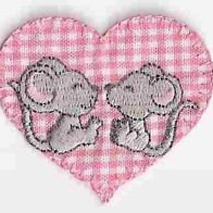 May include: Two gray embroidered mice kissing inside a pink and white gingham heart.