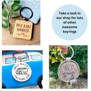 May include: Three different keychains with various designs. The first keychain is a wooden square with the text "DRY ROBE WANKER" engraved on it. The second keychain is a silver circle with the text "UNCLE MATTY'S AWESOME VAN" and a cartoon van. The third keychain is a silver circle with the text "EXPLORE ADVENTURE" and a mountain scene with a cabin.