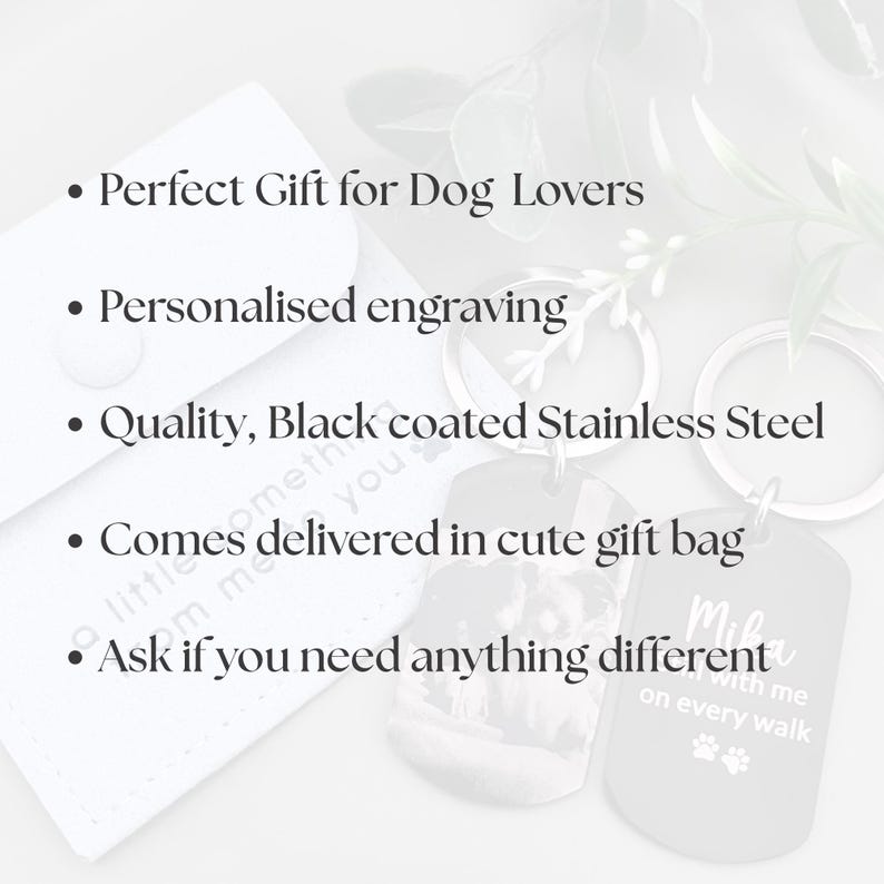 May include: Two black stainless steel dog tag keychains with silver rings. One tag features a photo engraving, the other has the text 'Mika, still with me on every walk' with paw prints. Text on image: Perfect Gift for Dog Lovers, Personalised engraving, Quality, Black coated Stainless Steel, Comes delivered in cute gift bag, Ask if you need anything different.