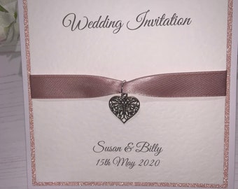 Wedding Invites - The Sparkly Collection - Rose Gold Sparkly Card with Rose Gold Ribbon with Butterfly Heart Charm
