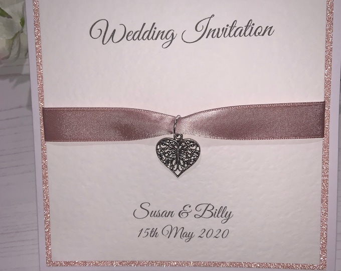 Wedding Invites - The Sparkly Collection - Rose Gold Sparkly Card with Rose Gold Ribbon with Butterfly Heart Charm