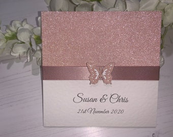 Wedding Invites - The Sparkly Collection - Rose Gold Sparkly Card with Rose Gold Ribbon with Butterfly