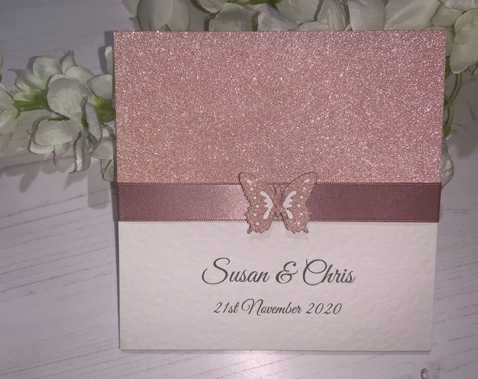 Wedding Invites - The Sparkly Collection - Rose Gold Sparkly Card with Rose Gold Ribbon with Butterfly